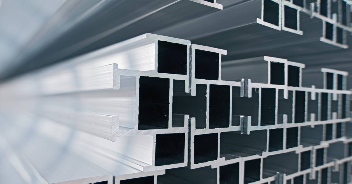 Aluminum profiles neatly arranged in a storage rack. Each profile is placed in a designated slot to ensure easy access.