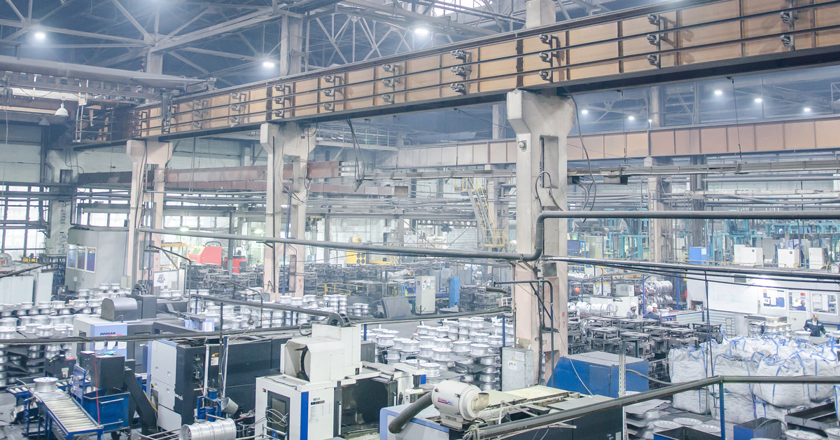 A foundry features various workstations and industrial equipment, with heavy machinery and tools organized.